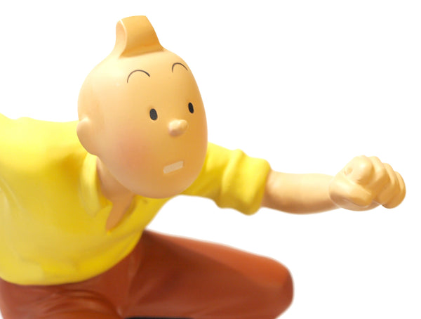 TINTIN: TINTIN SAUTANT LE TRONC D'ARBRE - statuette résine 25 cm (occasion)