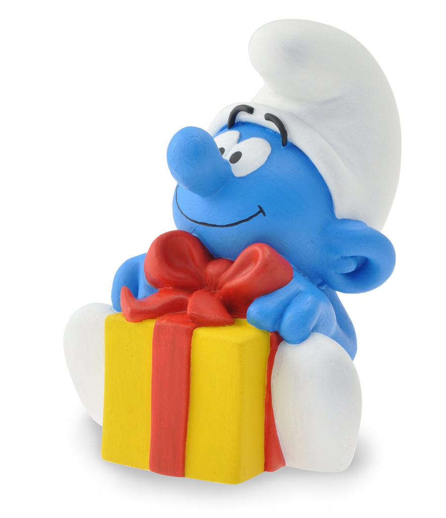 LES SCHTROUMPFS: LE SCHTROUMPF ET LE CADEAU - mini-tirelire pvc 9 cm
